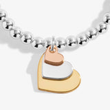 A Littles & Co 'Three Generations' Bracelet In Silver, Gold-Tone, And Rose Gold-Tone Plating